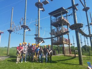 Group of adventurers at PA ropes course with ziplines