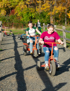 Kid having fun with outdoor activities Hellerick's Family Farm offers at their Doylestown farm