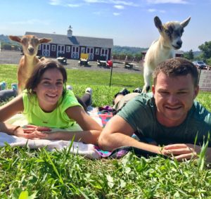 Young couple at goat yoga in Doylestown