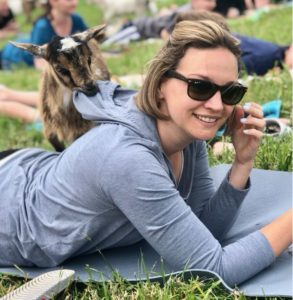 Curious goat with woman at Doylestown PA goat experience