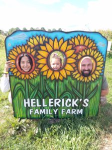 Family taking a photo at Hellericks Family Farm