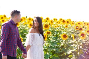 Professional photo of couple in sunflower field