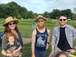 Redheaded family celebrating uniqueness at redhead celebration day at Hellerick's Family Farm