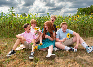 Professional photo of children in sunflower field