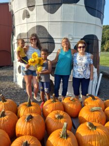 Family enjoying pumpkin picking and sunflower days at Bucks County farm