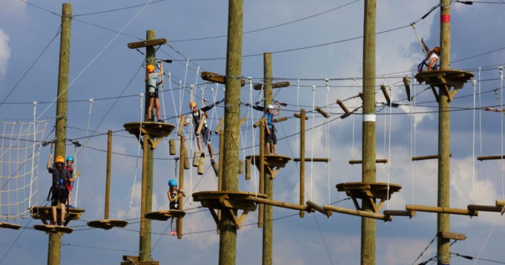 A group of people unleashing their inner explorers at Hellerick's aerial adventure ropes course