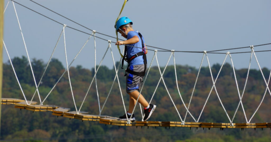Child crossing the Aerial Adventure Course as a fun outdoor activity in Bucks County PA